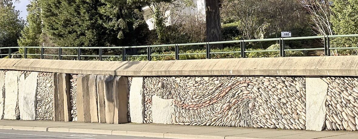 "Love Story" or the Great Wall of View Royal, was created by stonewall artist Andreas Kunert in collaboration with his wife, Naomi Zettl, of the Ancient Art of Stone.